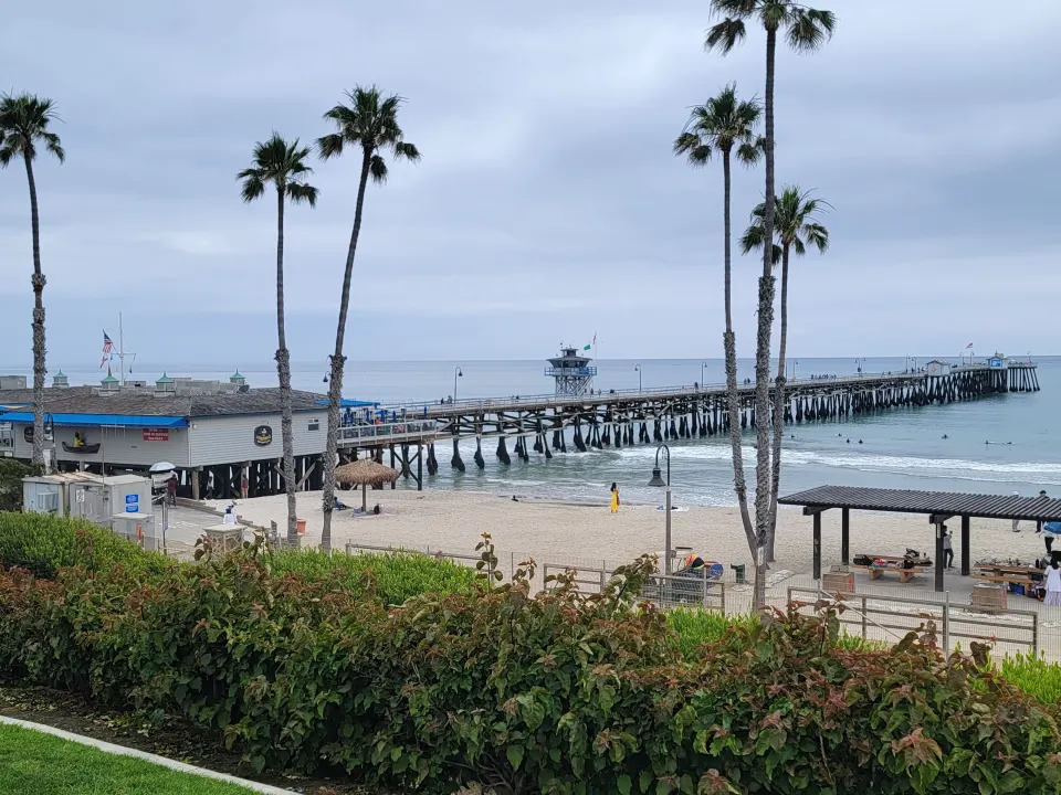 The San Clemente Pier stretching over the Pacific on a sunny day