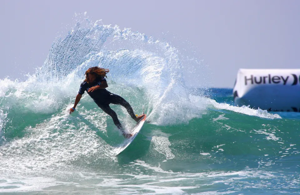 A surfer carving a cutback on a clean wave at Lower Trestles, San Clemente