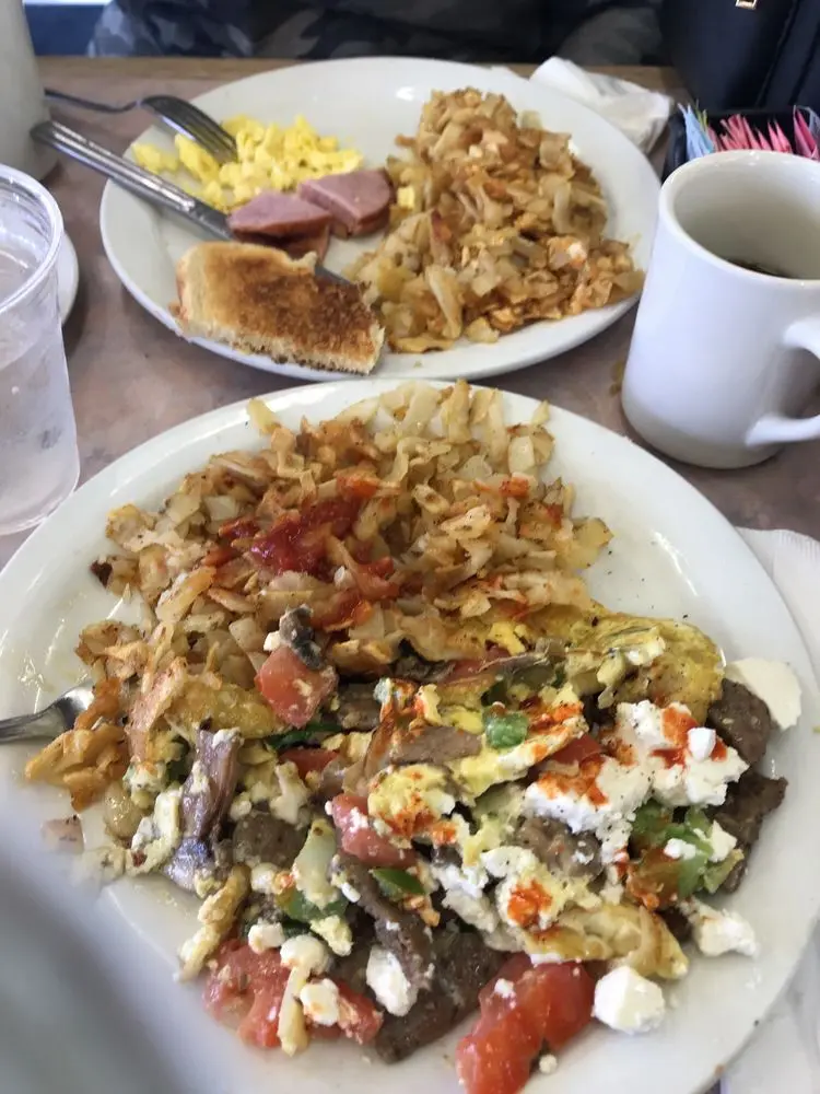Gyro-style scramble with feta cheese, peppers and tomato served with hash browns